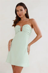 A sweet and spicy strapless mini dress – a must-have for a flirty and alluring look